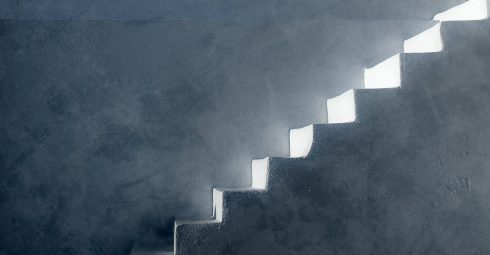 Iconic white stairs of a Santorini cave house